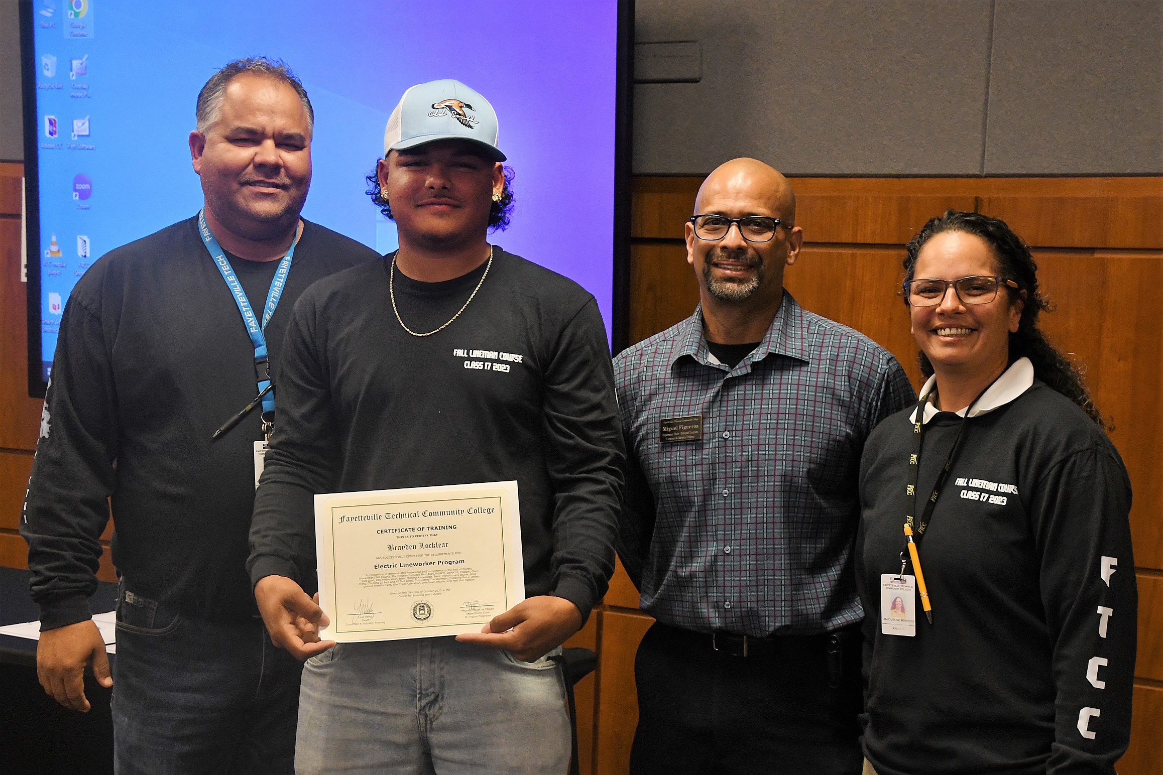 A graduate of FTCC's Electric Lineworker Basic Training course poses after receiving his certificate.