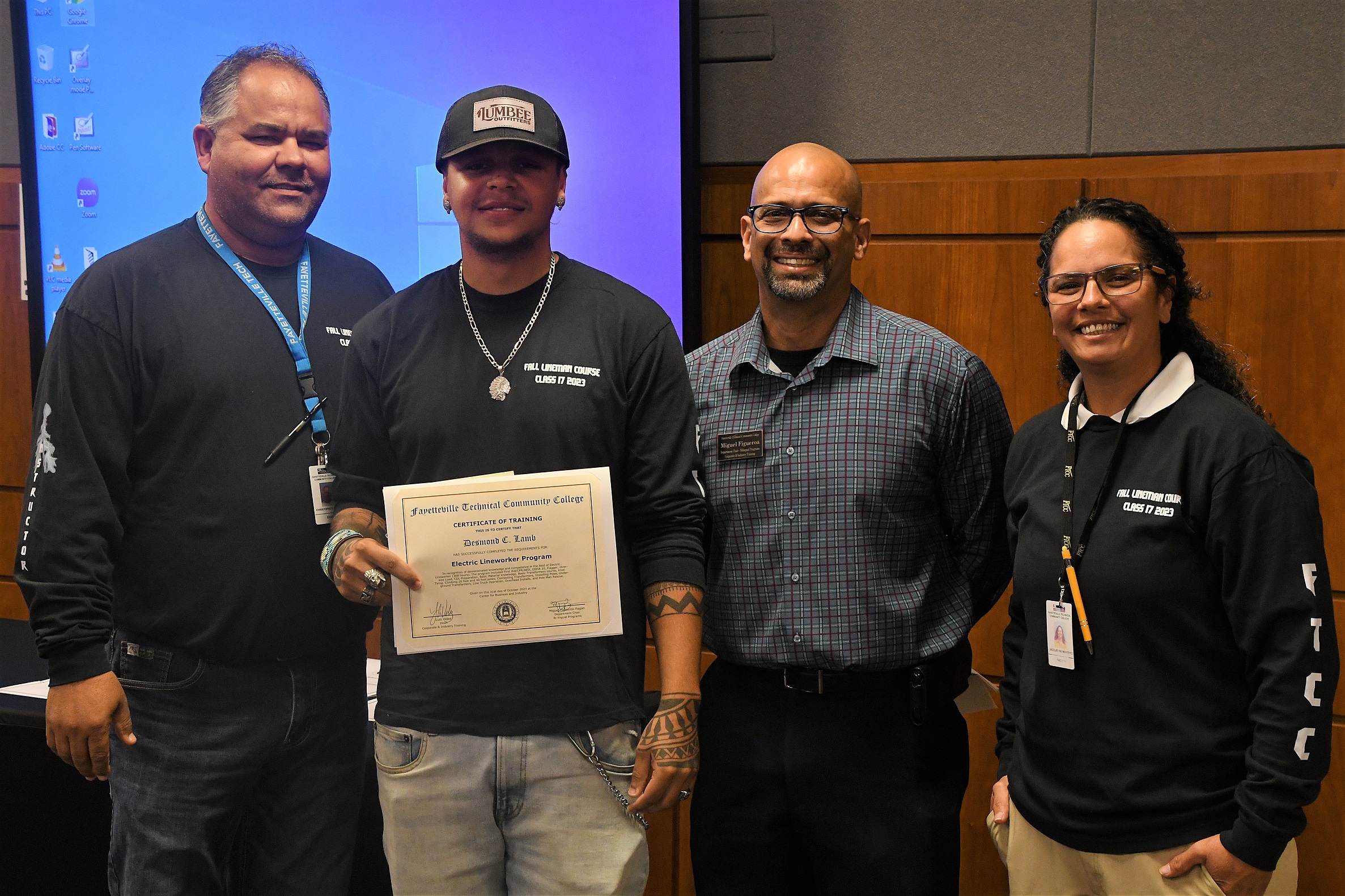 A graduate of FTCC's Electric Lineworker Basic Training course poses after receiving his certificate.