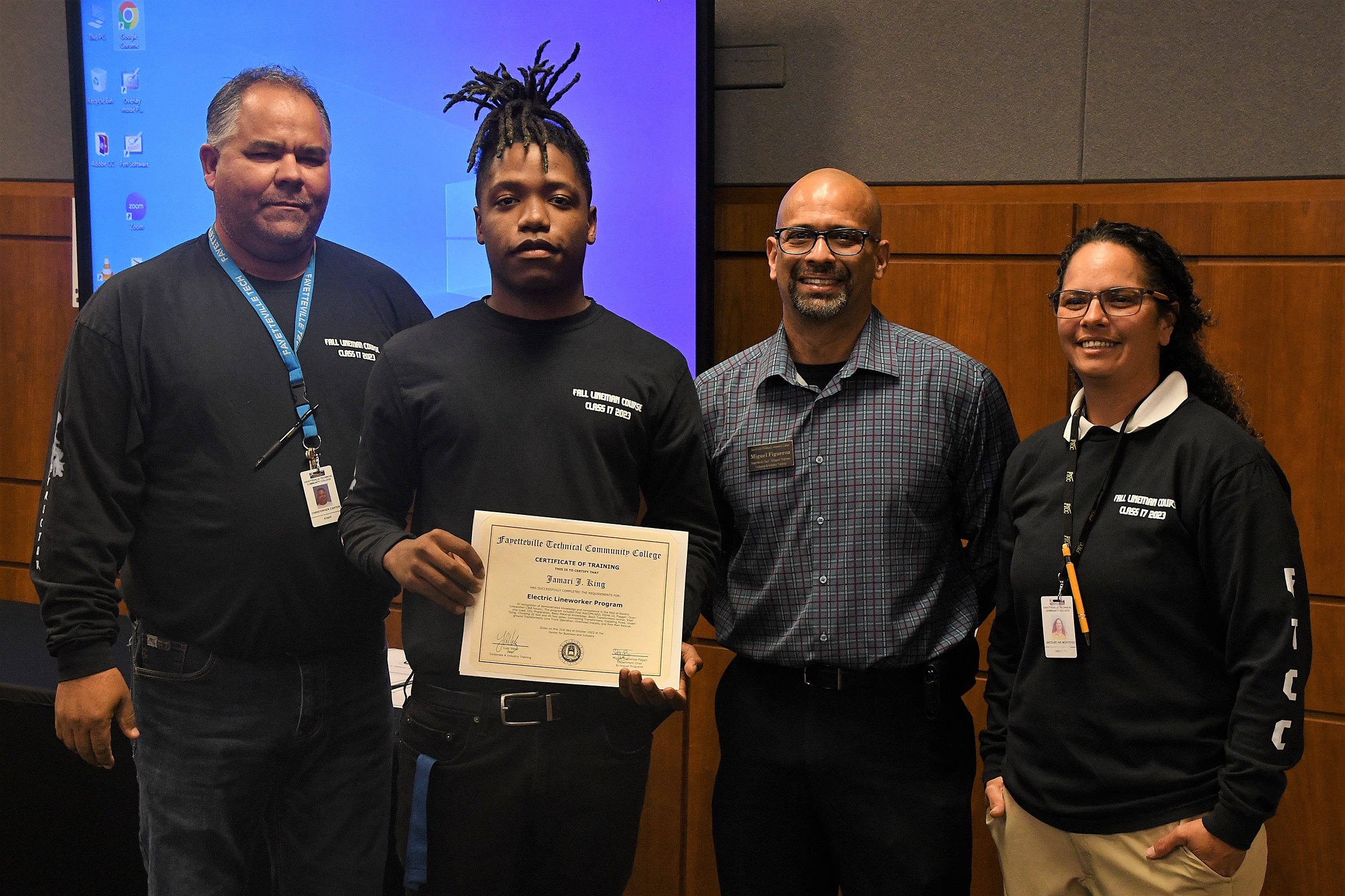 A graduate of FTCC's Electric Lineworker Basic Training course poses after receiving his certificate.