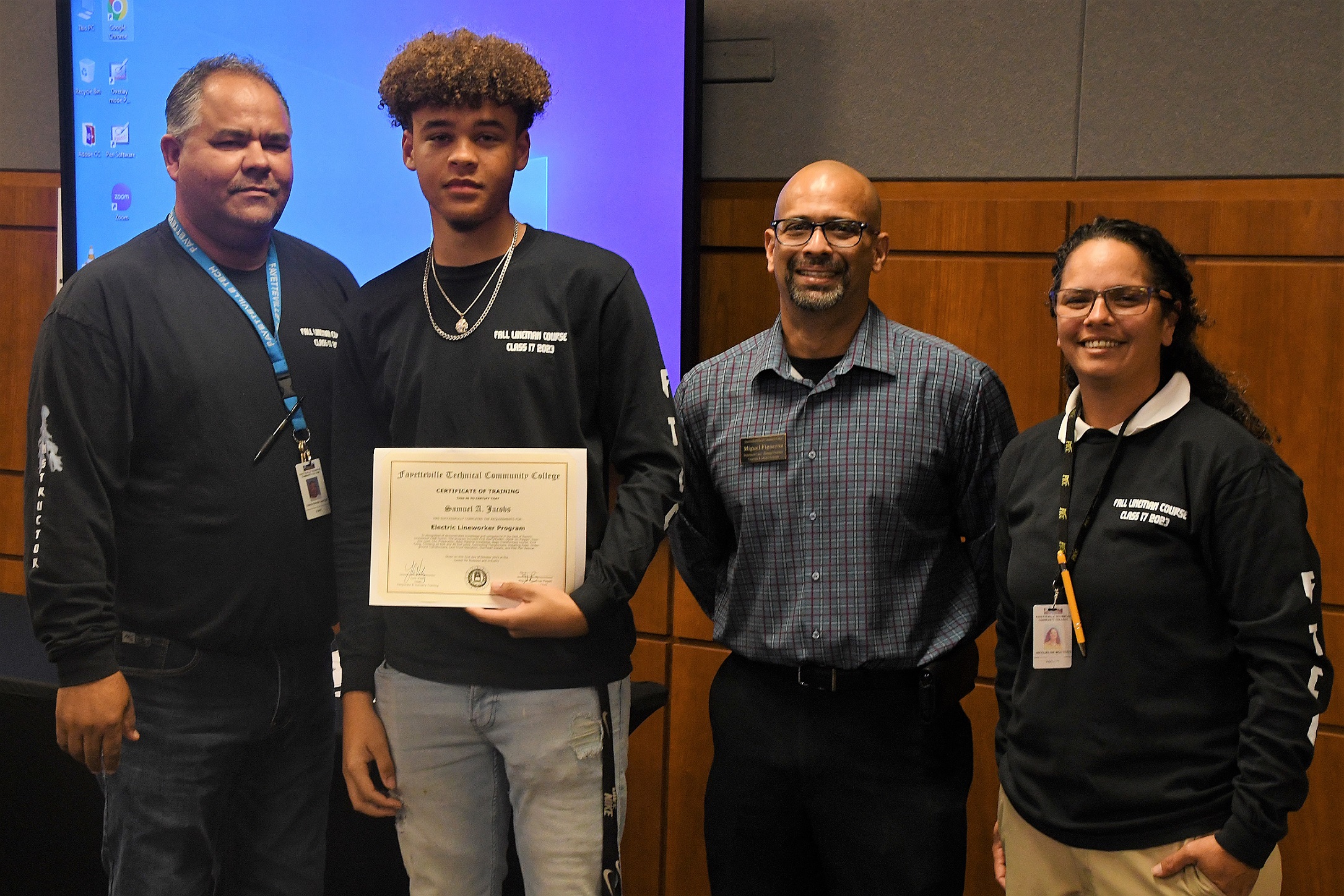 A graduate of FTCC's Electric Lineworker Basic Training course poses after receiving his certificate.