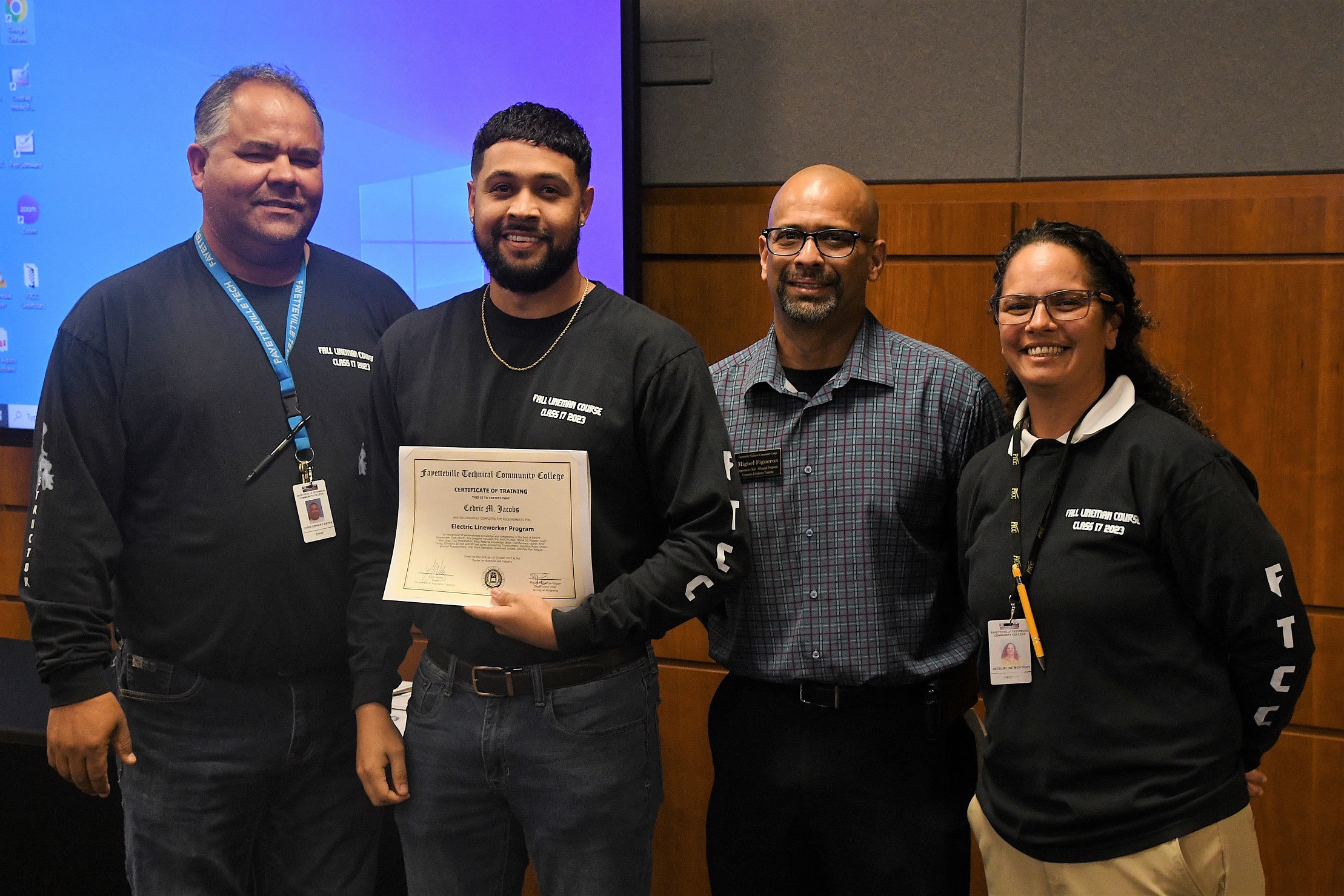 A graduate of FTCC's Electric Lineworker Basic Training course poses after receiving his certificate.