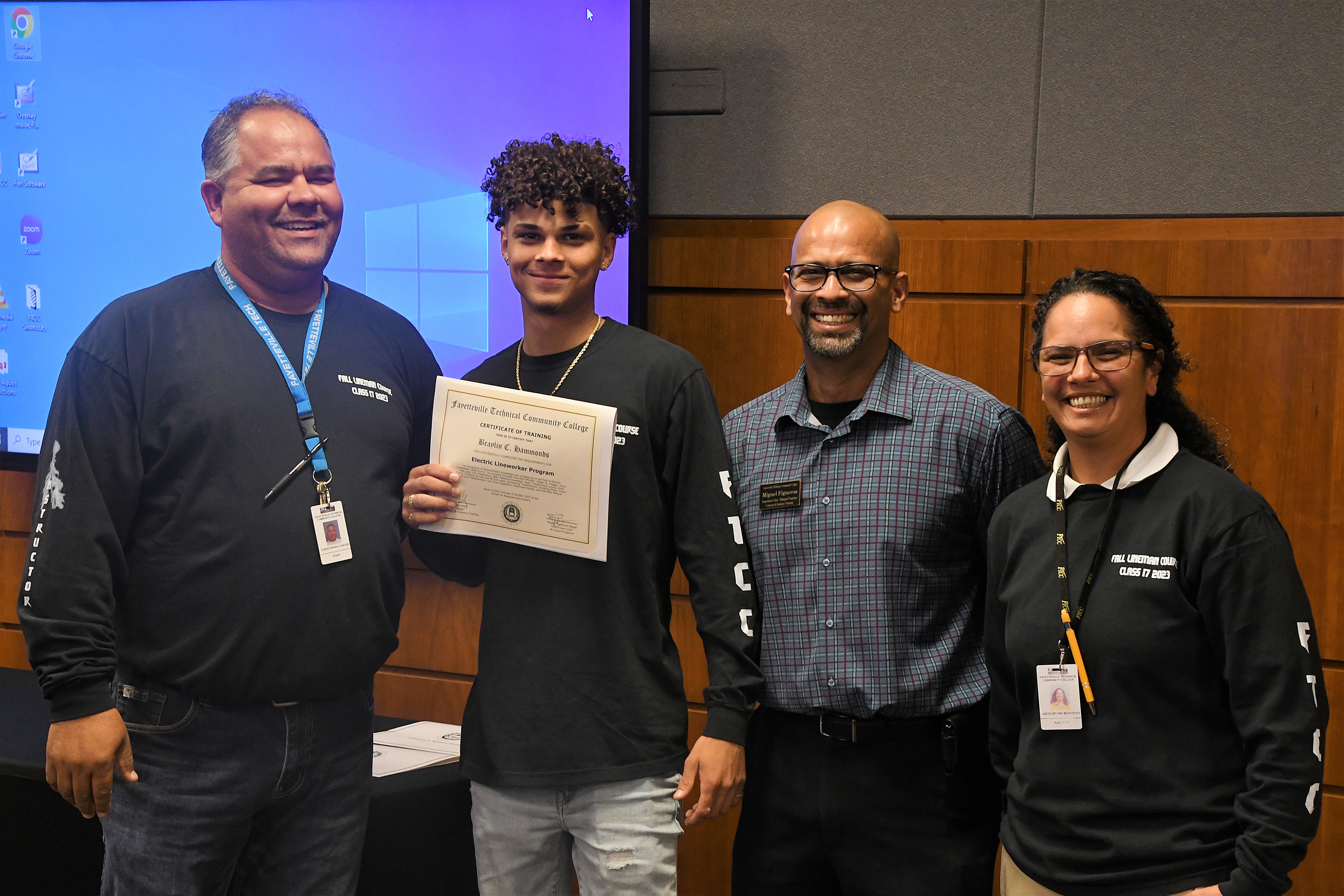 A graduate of FTCC's Electric Lineworker Basic Training course poses after receiving his certificate.