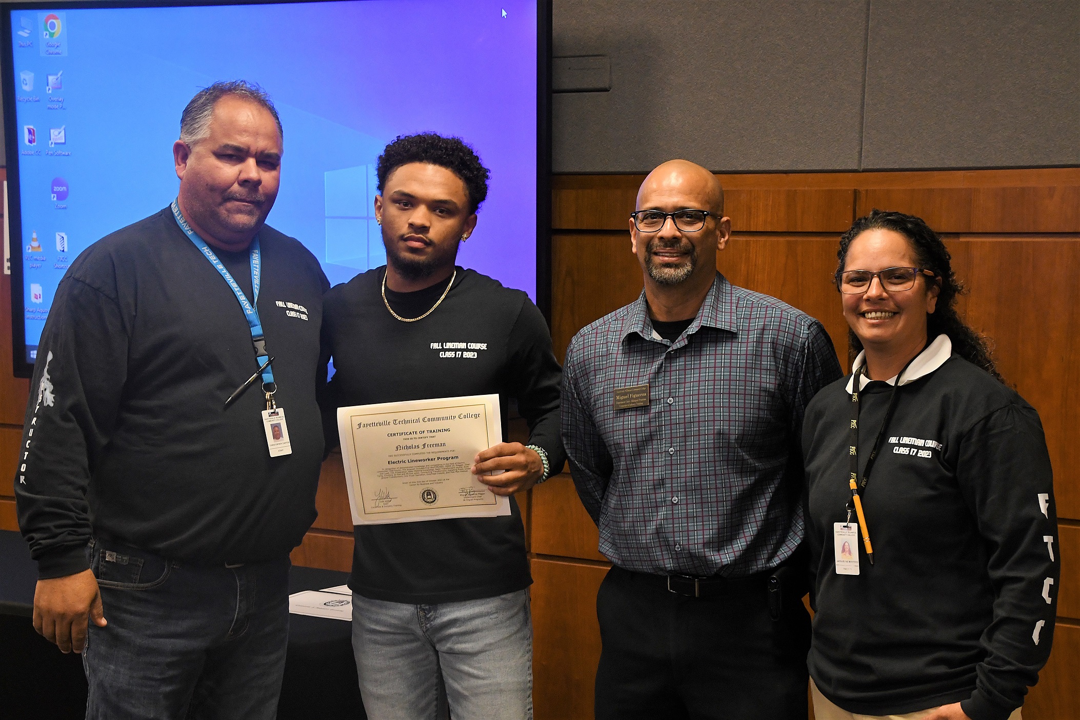 A graduate of FTCC's Electric Lineworker Basic Training course poses after receiving his certificate.