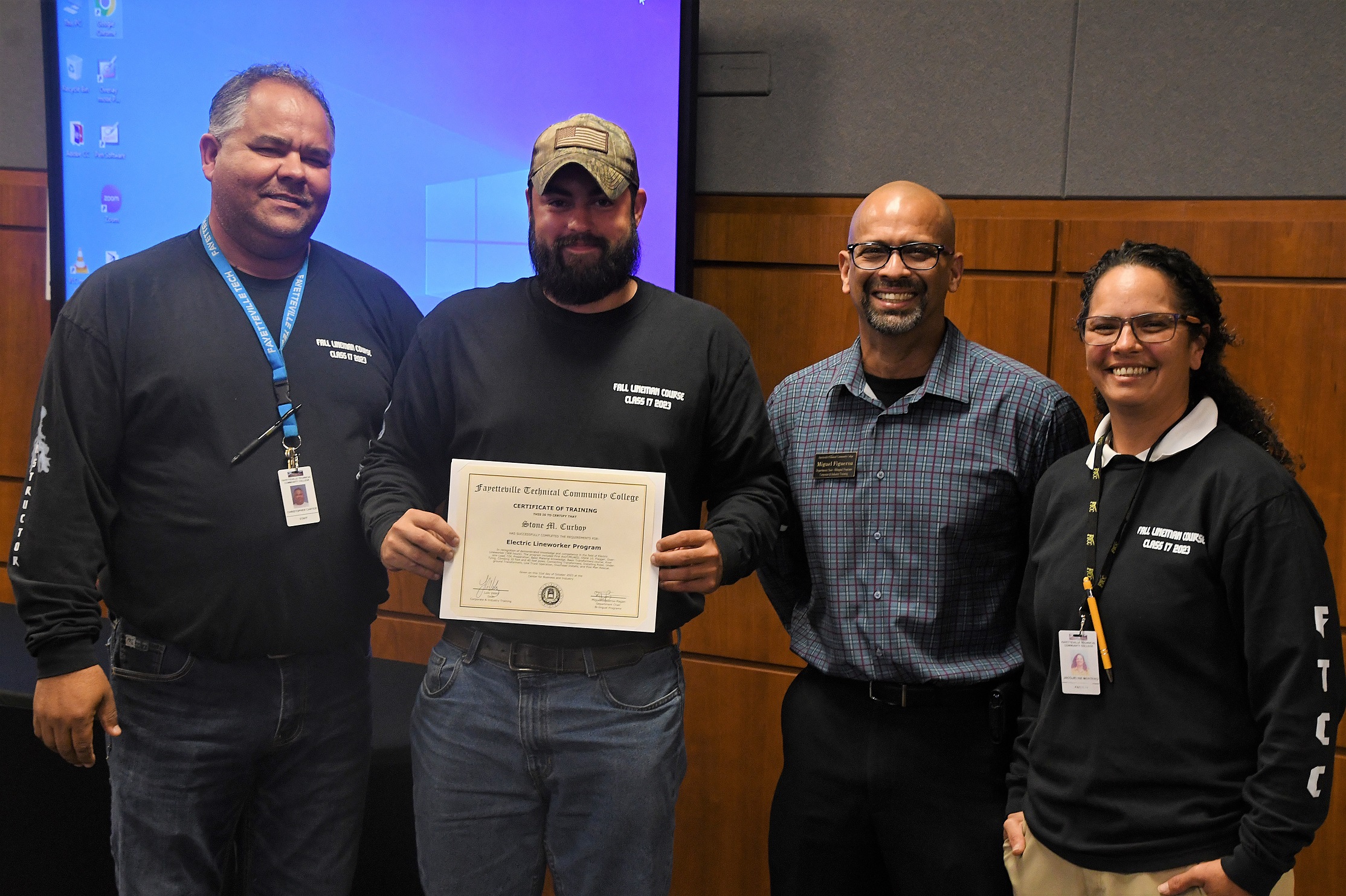 A graduate of FTCC's Electric Lineworker Basic Training course poses after receiving his certificate.