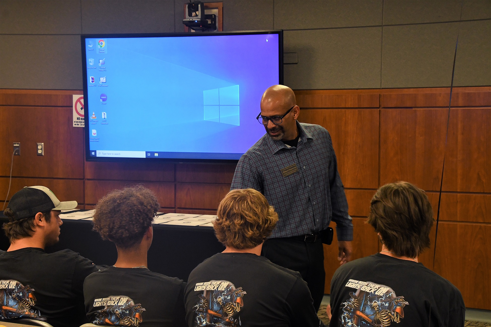 Department Chair Miguel Figueroa talks to the graduates before the ceremony.