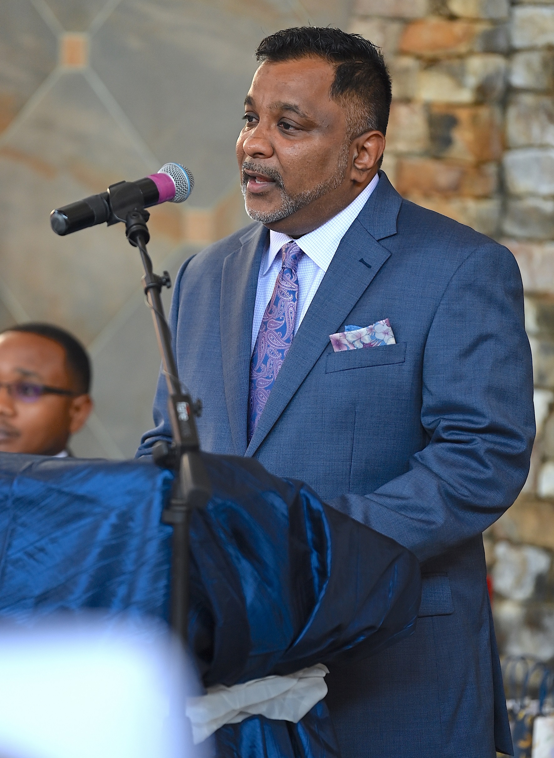 A speaker addresses the graduates at the pinning ceremony.