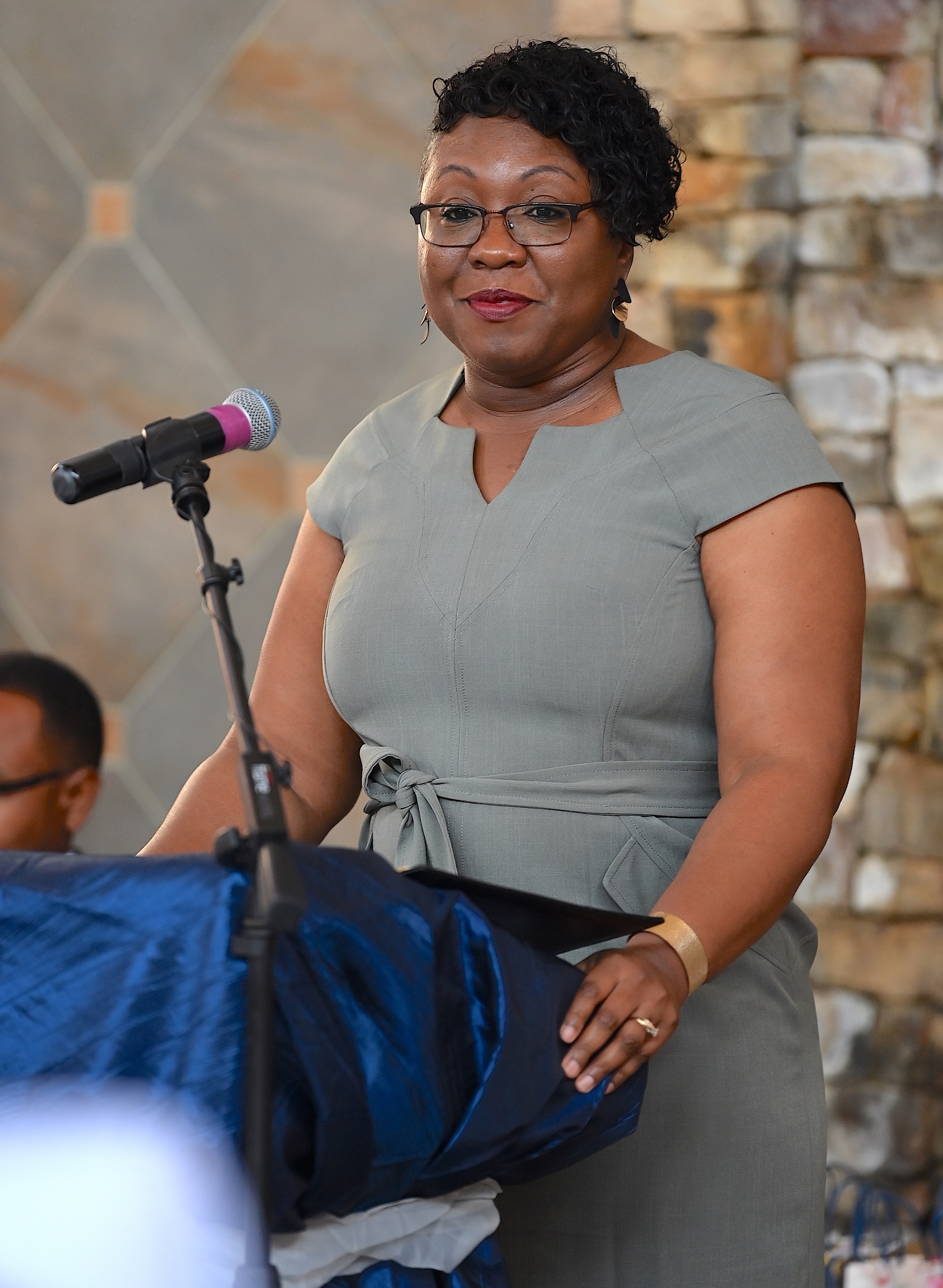 A speaker address the graduates at the pinning ceremony.