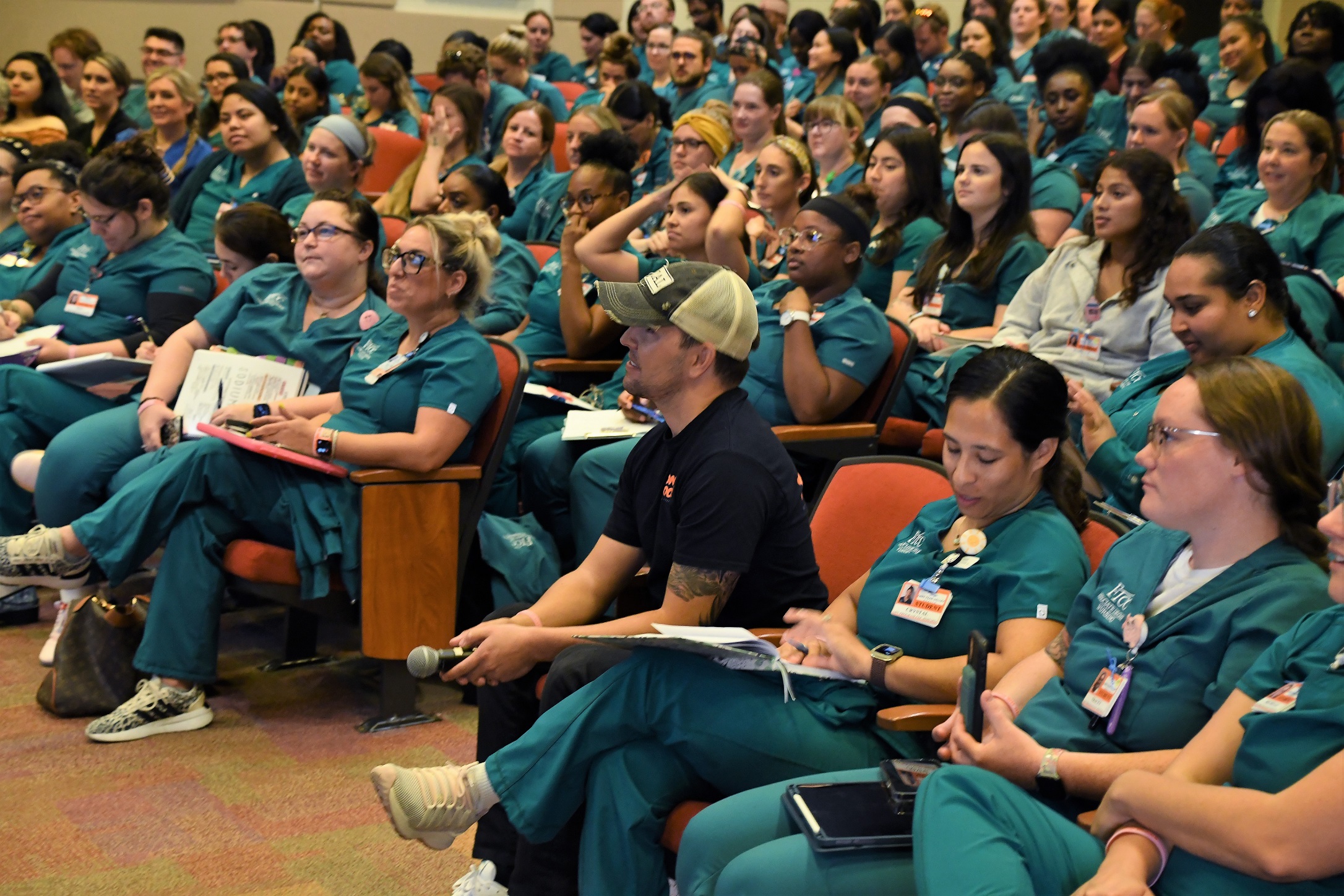 Nurse Blake sits in the audience with FTCC Nursing students. [Photo by Natasha Brown]
