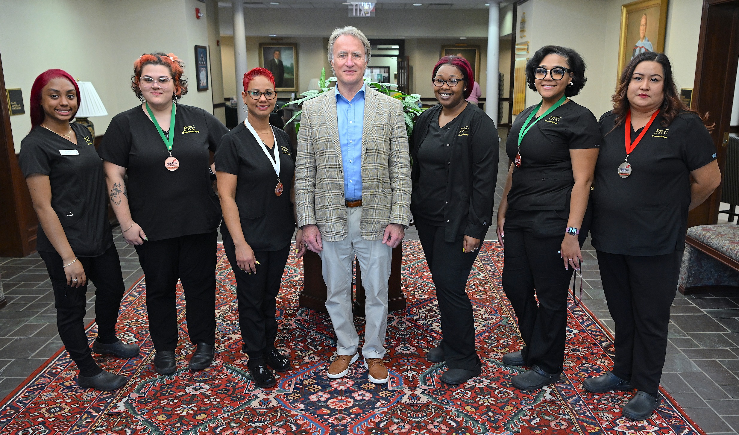FTCC President Dr. Mark Sorrells stands with SkillsUSA winners in Cosmetology.