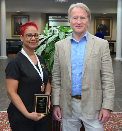 Carmen Agramonte-Duran (3rd place, Cosmetology) stands with FTCC President Dr. Mark Sorrells.