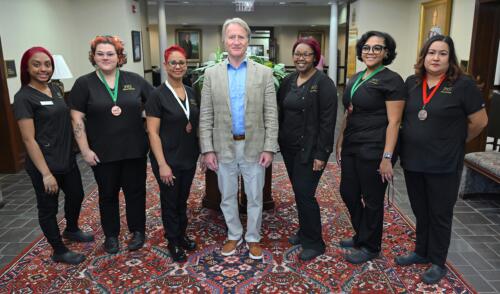 FTCC President Dr. Mark Sorrells stands with SkillsUSA winners in Cosmetology.